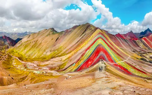 Rainbow Mountain with hikers on trail, Cusco, Peru.