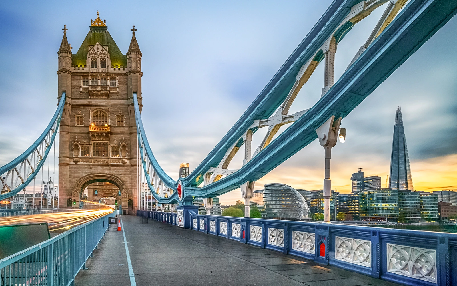 Tower Bridge in London with the Shard in the background at sunset.
