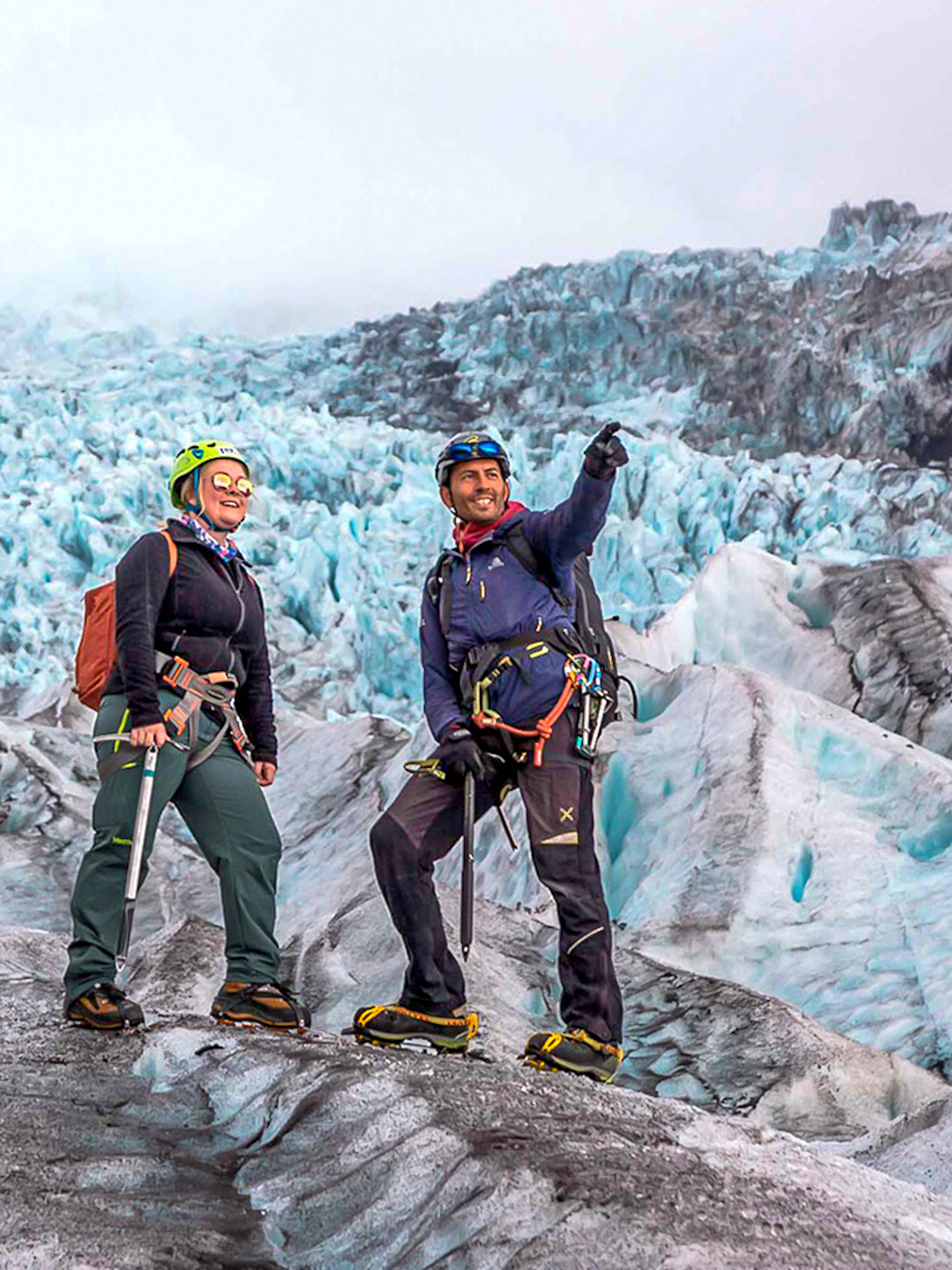 Guests on a glacier expedition at Vatnajökull, Iceland, wearing climbing gear.