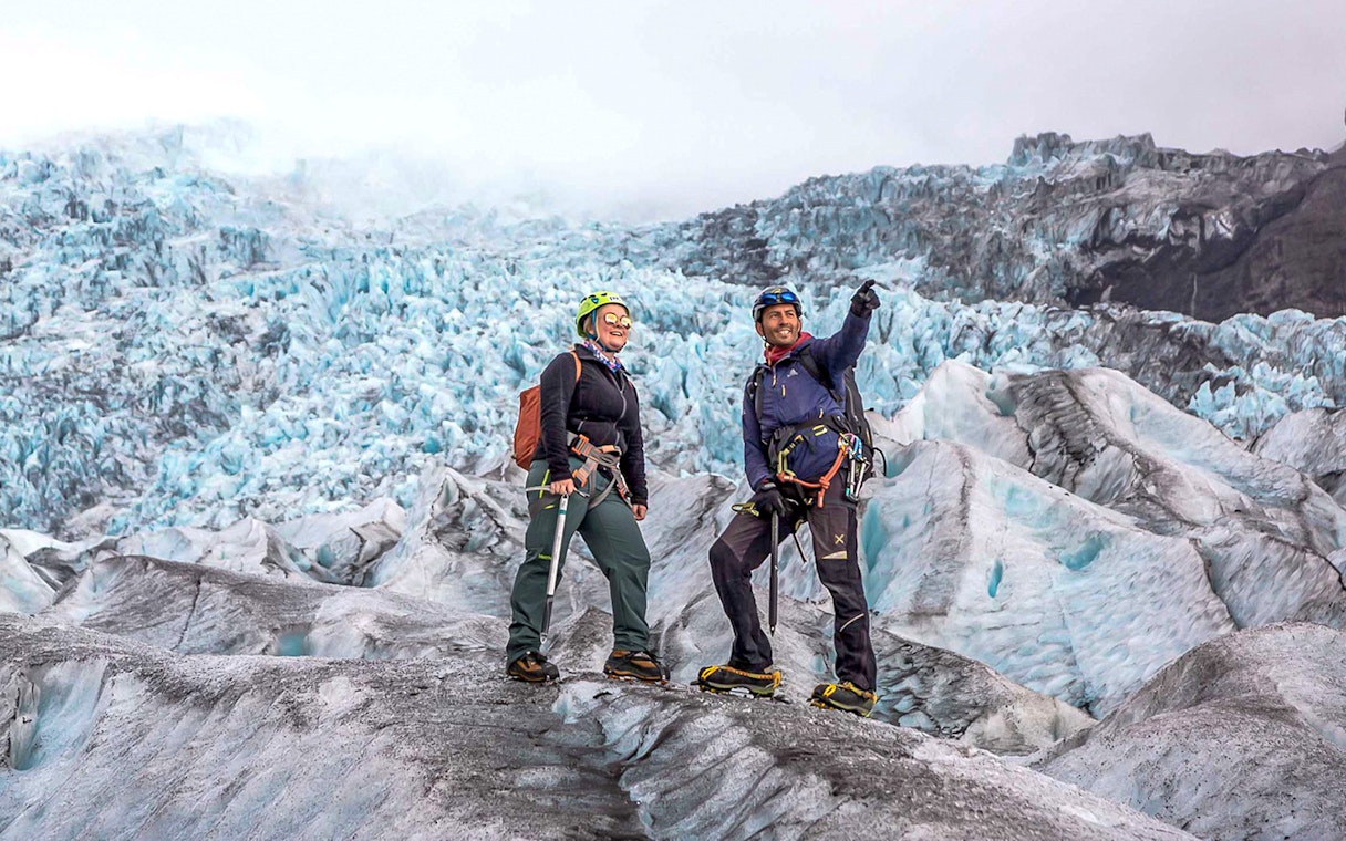 Guests on a glacier expedition at Vatnajökull, Iceland, wearing climbing gear.