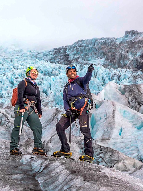 Guests on a glacier expedition at Vatnajökull, Iceland, wearing climbing gear.