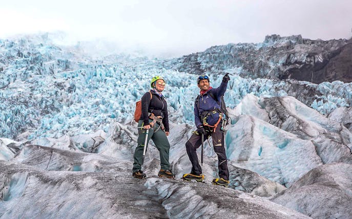 Guests on a glacier expedition at Vatnajökull, Iceland, wearing climbing gear.