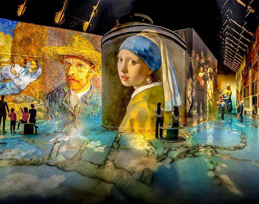 Immersive art projections at Fabrique des Lumières featuring Van Gogh and Vermeer.