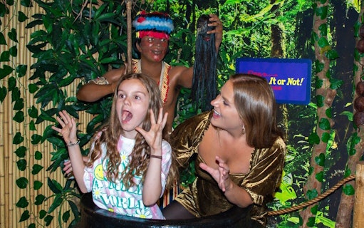 Visitors posing in a jungle-themed exhibit at Ripley's Believe It or Not!