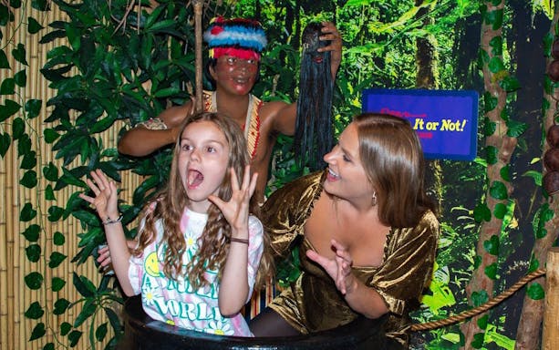 Visitors posing in a jungle-themed exhibit at Ripley's Believe It or Not!