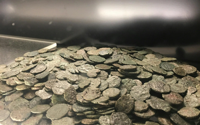 Ancient coins displayed in the Trevi District Underground tour, Rome.