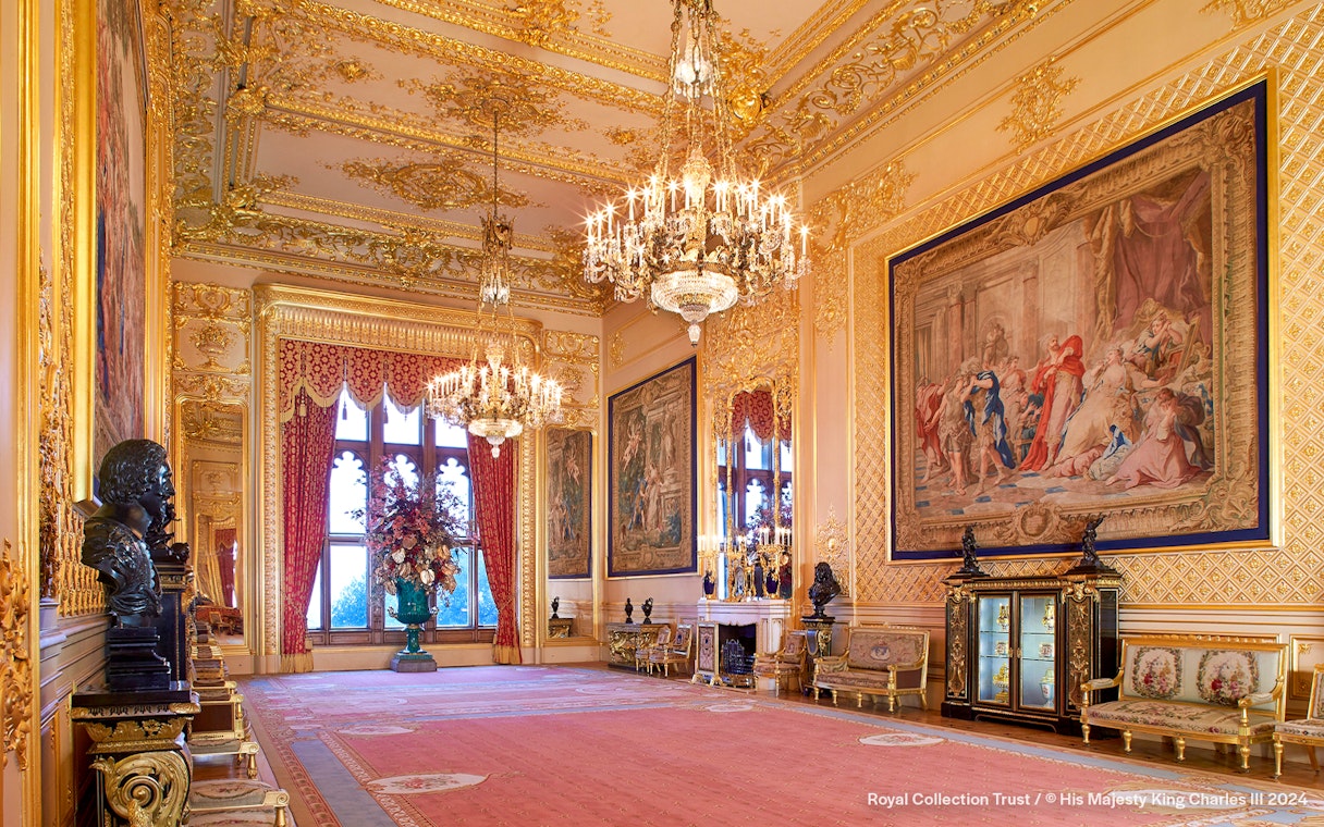 Grand Reception Room at Windsor Castle with chandeliers and ornate tapestries.