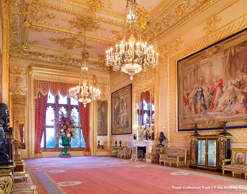Grand Reception Room at Windsor Castle with chandeliers and ornate tapestries.