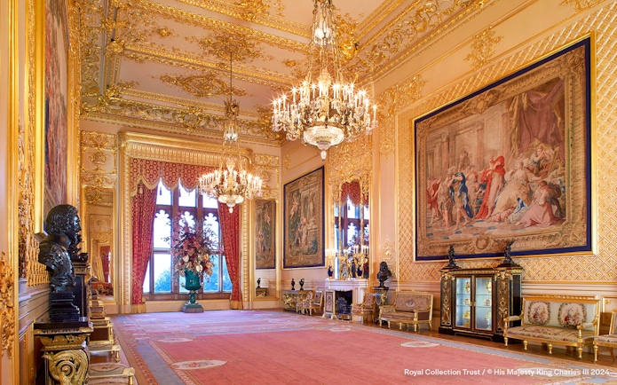 Grand Reception Room at Windsor Castle with chandeliers and ornate tapestries.
