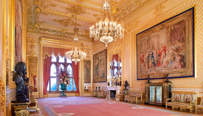 Grand Reception Room at Windsor Castle with chandeliers and ornate tapestries.