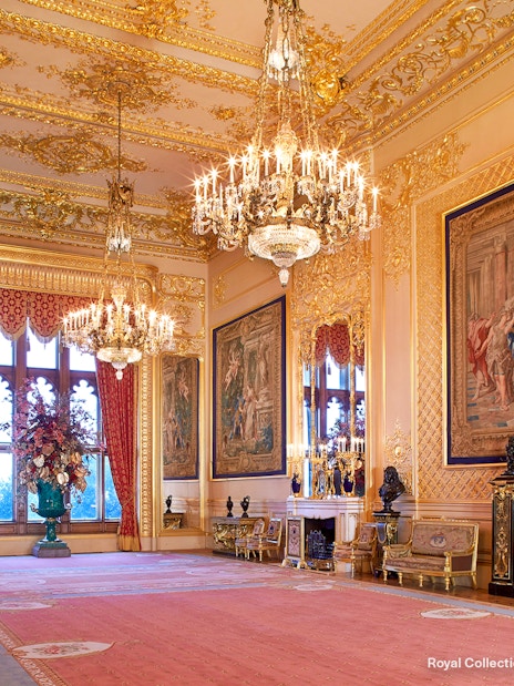 Grand Reception Room at Windsor Castle with chandeliers and ornate tapestries.