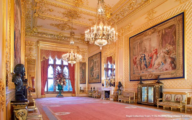 Grand Reception Room at Windsor Castle with chandeliers and ornate tapestries.