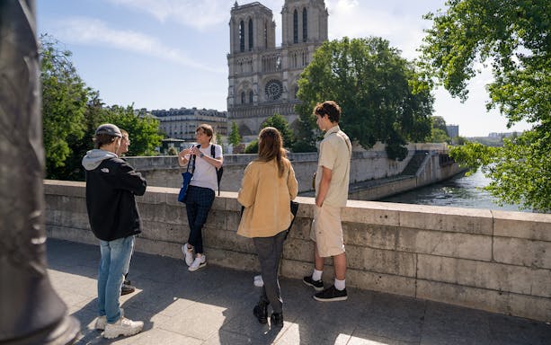 Guided tour group near Notre Dame Cathedral in Paris.