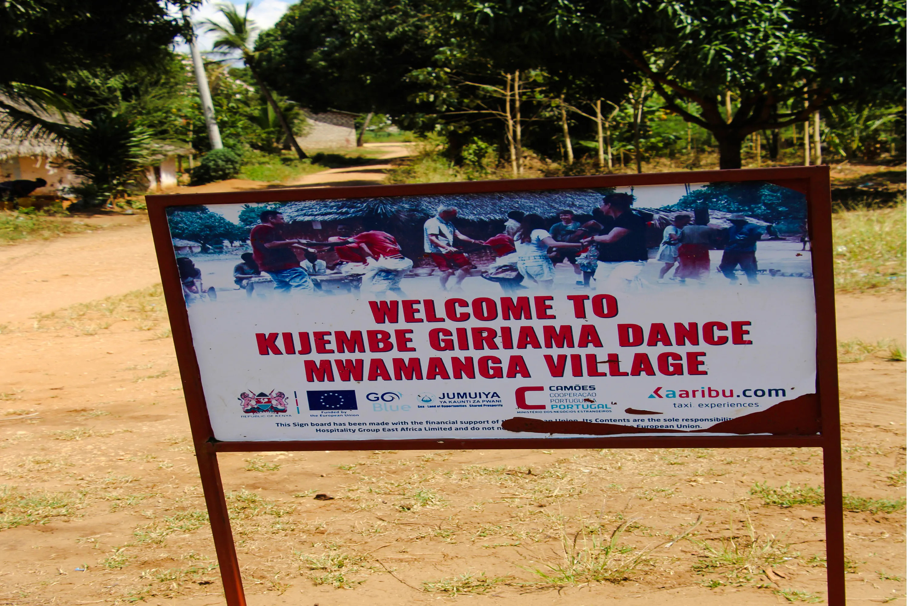 Kijembe Giriama Dance sign at Mwamanga Village entrance, Diani Beach tour.