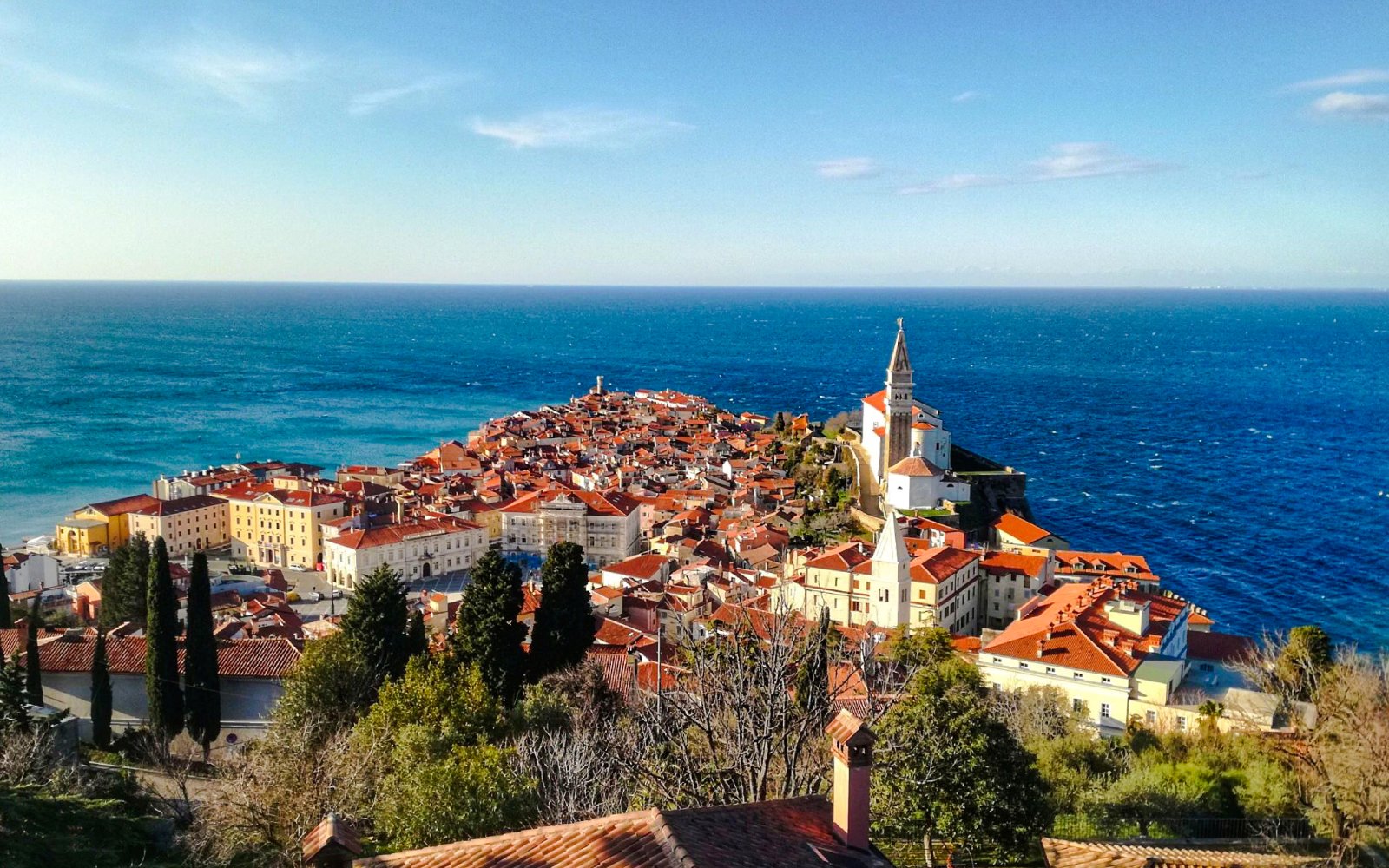 Piran Town in Slovenia with coastal view and historic church tower.