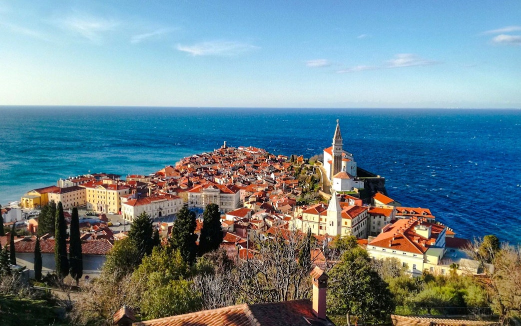 Piran Town in Slovenia with coastal view and historic church tower.