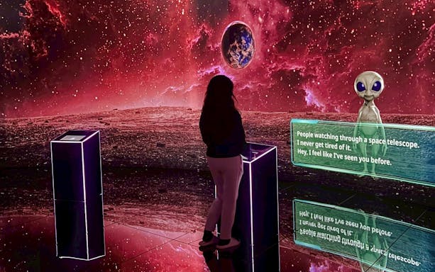 Tourist interacting with an alien exhibit at MIRACLEWORLD Osaka.