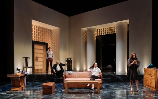 Theater scene from "Bitter Wheat" with four actors on stage in a modern set.