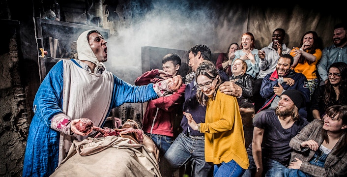 Guests reacting to a live performance at the Amsterdam Dungeon.