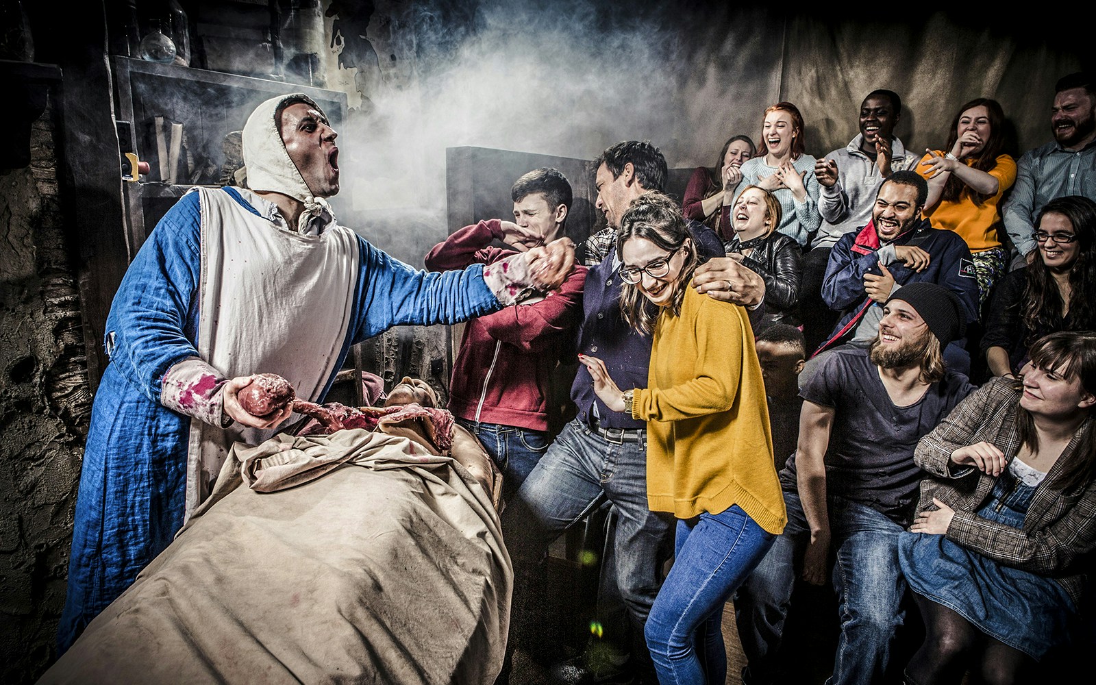 Guests reacting to a live performance at the Amsterdam Dungeon.