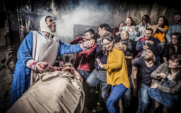 Guests reacting to a live performance at the Amsterdam Dungeon.