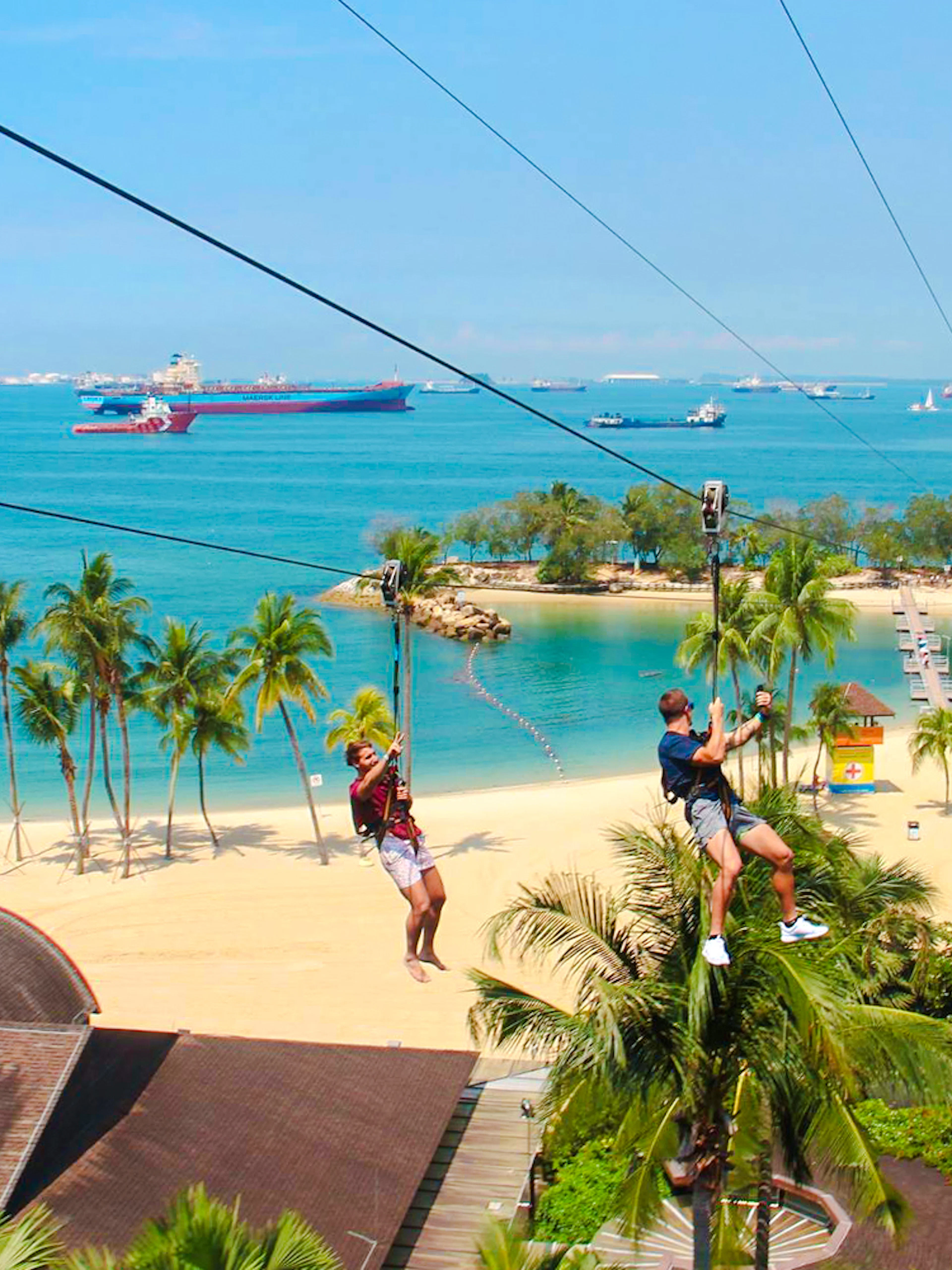 Ziplining over Sentosa Beach at Mega Adventure Park, Singapore.
