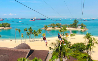 Ziplining over Sentosa Beach at Mega Adventure Park, Singapore.