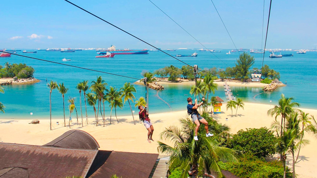 Ziplining over Sentosa Beach at Mega Adventure Park, Singapore.