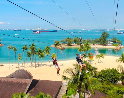 Ziplining over Sentosa Beach at Mega Adventure Park, Singapore.