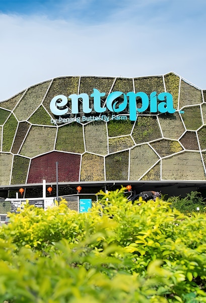 Entopia by Penang Butterfly Farm entrance with green wall and foliage.