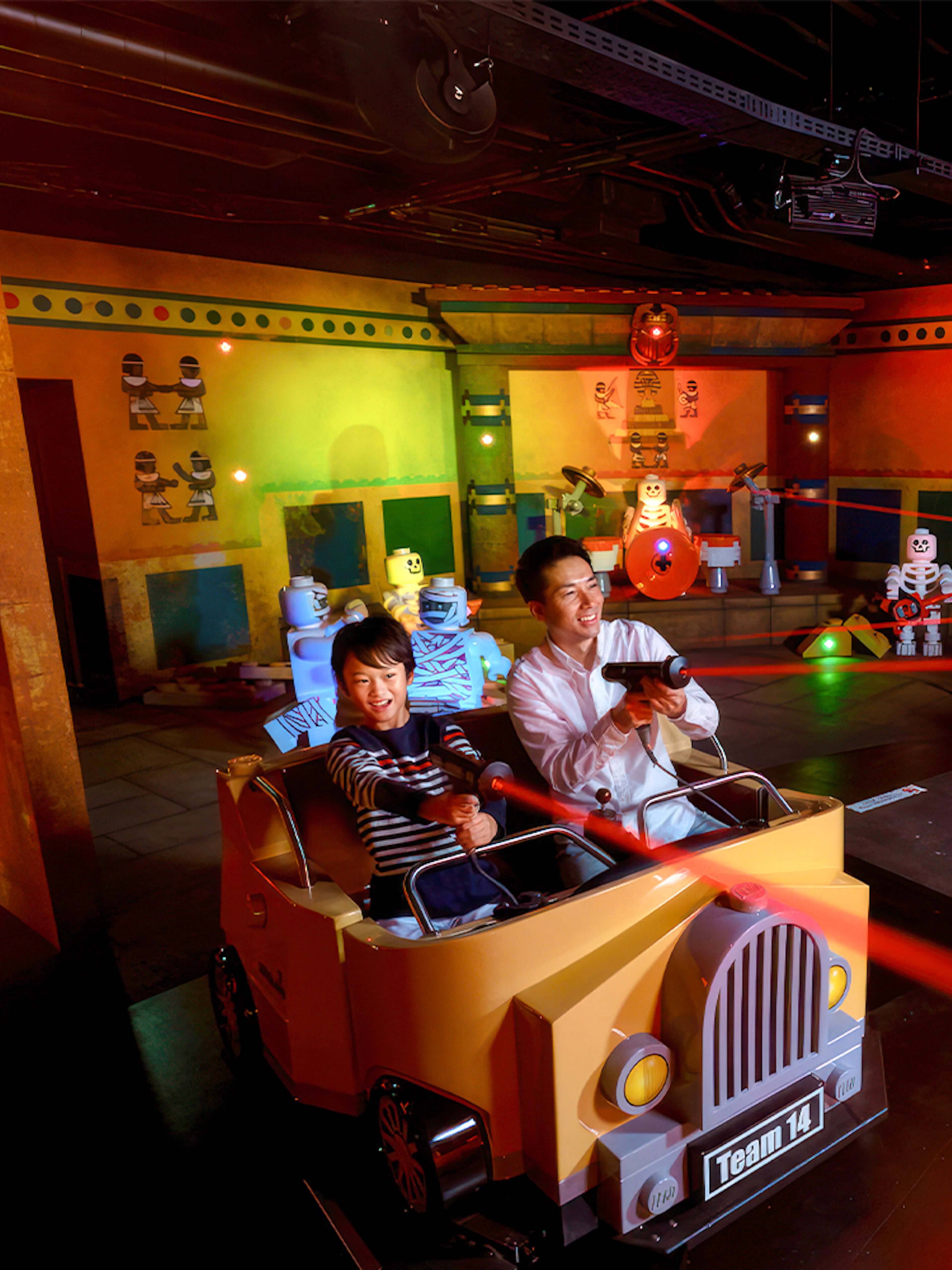 Visitors enjoying a laser ride at Legoland Japan.