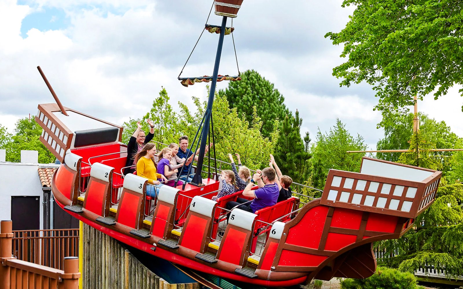 Guests on a swinging pirate ship ride at LEGOLAND Billund.