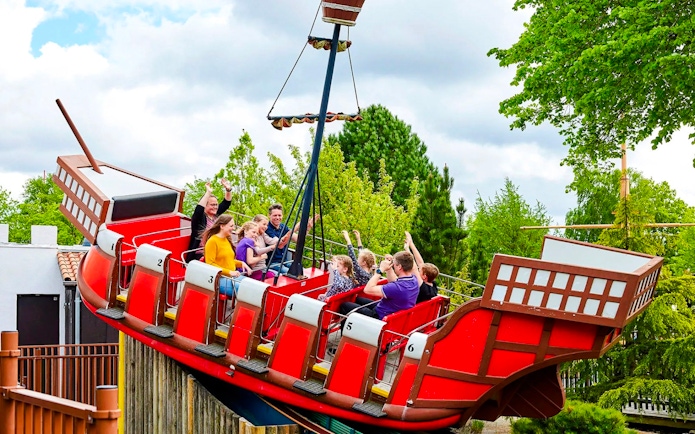 Guests on a swinging pirate ship ride at LEGOLAND Billund.