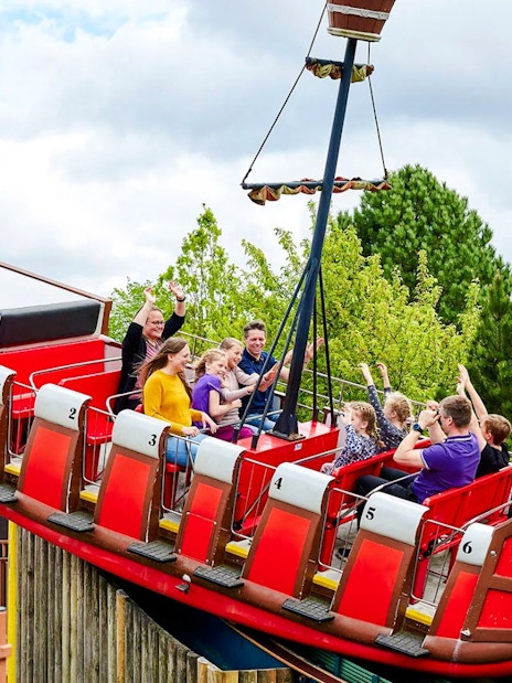 Guests on a swinging pirate ship ride at LEGOLAND Billund.