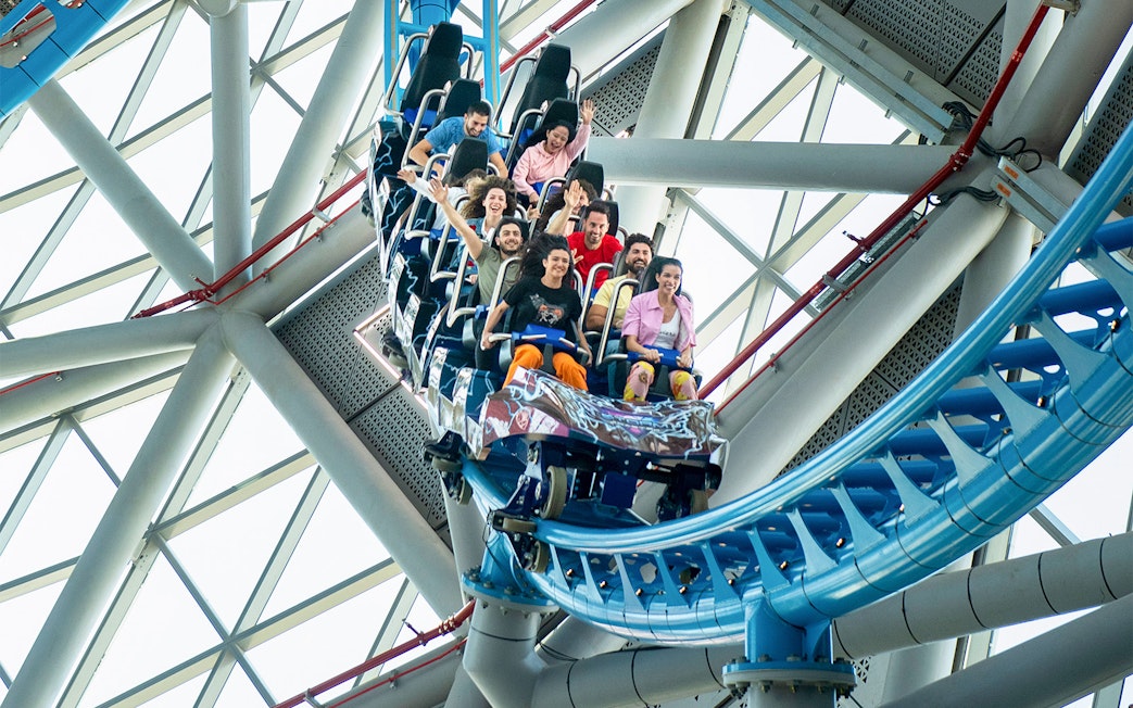 Riders enjoying The Storm Coaster in Dubai's indoor theme park.