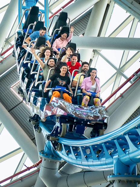 Riders enjoying The Storm Coaster in Dubai's indoor theme park.
