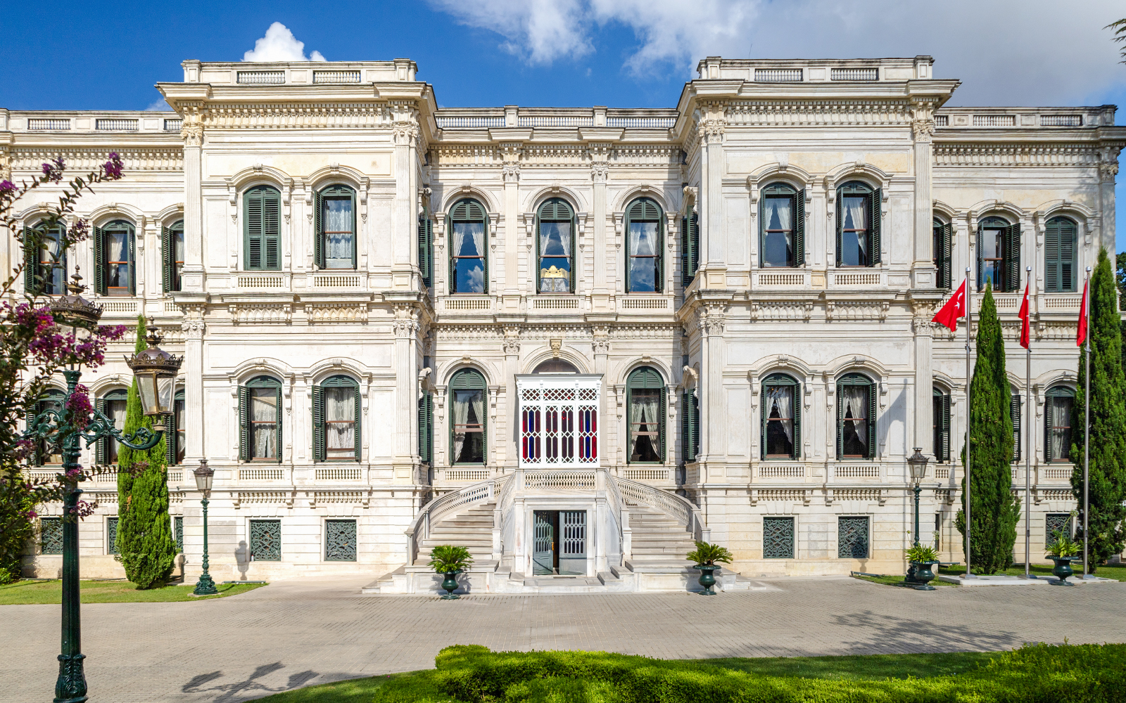 Exterior of Yıldız Palace with ornate windows and Turkish flags, Istanbul.