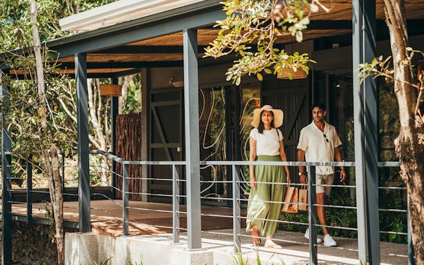 Visitors walking on Chamarel 7 Coloured Earth plantation tour in Mauritius.