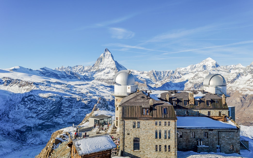 Gornergrat observatory with Matterhorn in background, view from Zermatt train journey.
