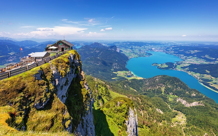 Cliffside view of St. Wolfgang and Salzkammergut lake during a guided tour in Salzburg.