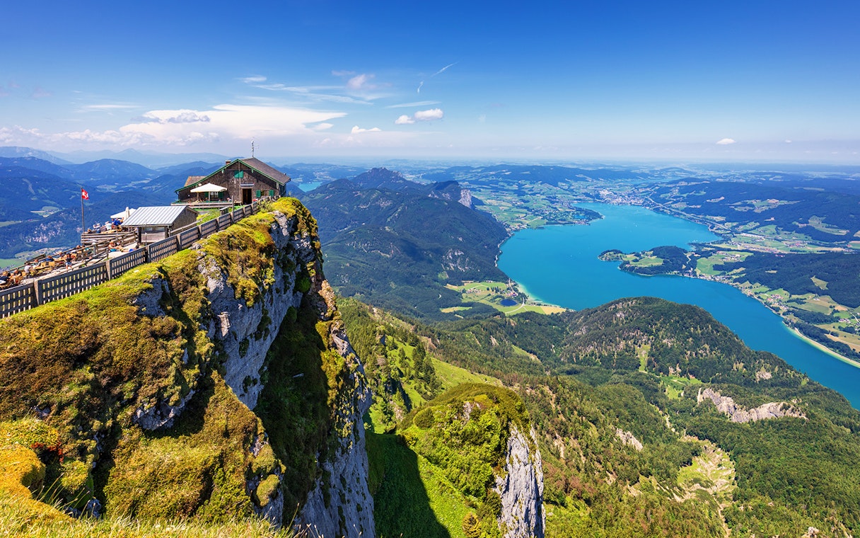 Cliffside view of St. Wolfgang and Salzkammergut lake during a guided tour in Salzburg.