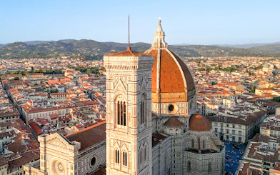 Florence Cathedral with dome and bell tower, view of cityscape.