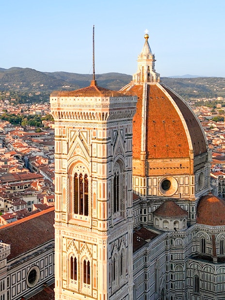 Florence Cathedral with dome and bell tower, view of cityscape.