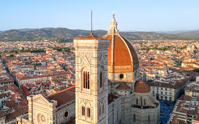 Florence Cathedral with dome and bell tower, view of cityscape.