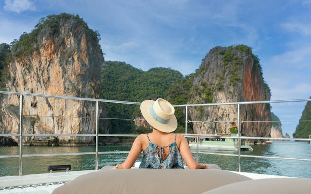 Premium yacht cruising near limestone cliffs during James Bond Sunset Tour, Phuket.