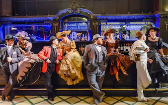 Tango dancers in vintage attire at El Querandí Tango Show, Buenos Aires.