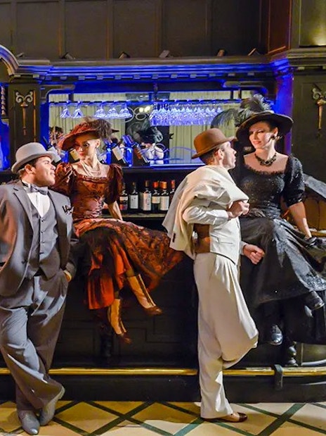 Tango dancers in vintage attire at El Querandí Tango Show, Buenos Aires.