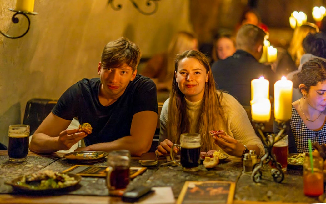 Guests enjoying a medieval dinner at Dětenice Brewery near Prague.
