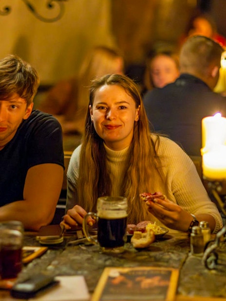 Guests enjoying a medieval dinner at Dětenice Brewery near Prague.