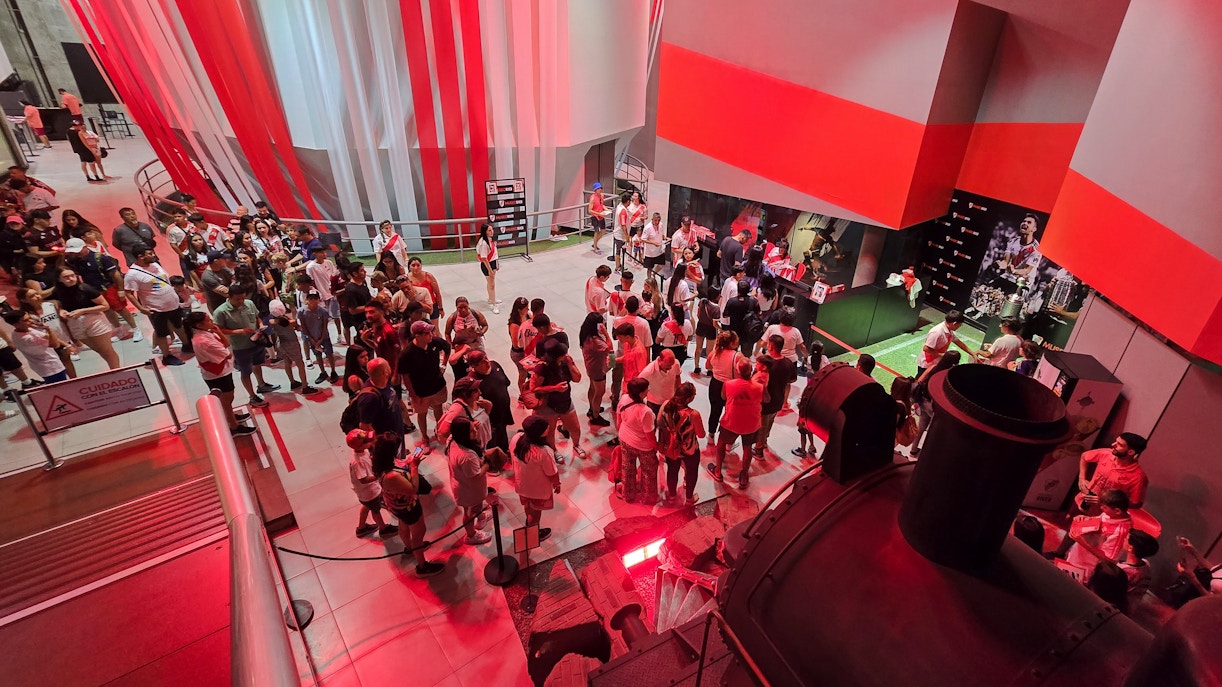 Visitors exploring exhibits at Museo River in Mâs Monumental stadium, Buenos Aires.